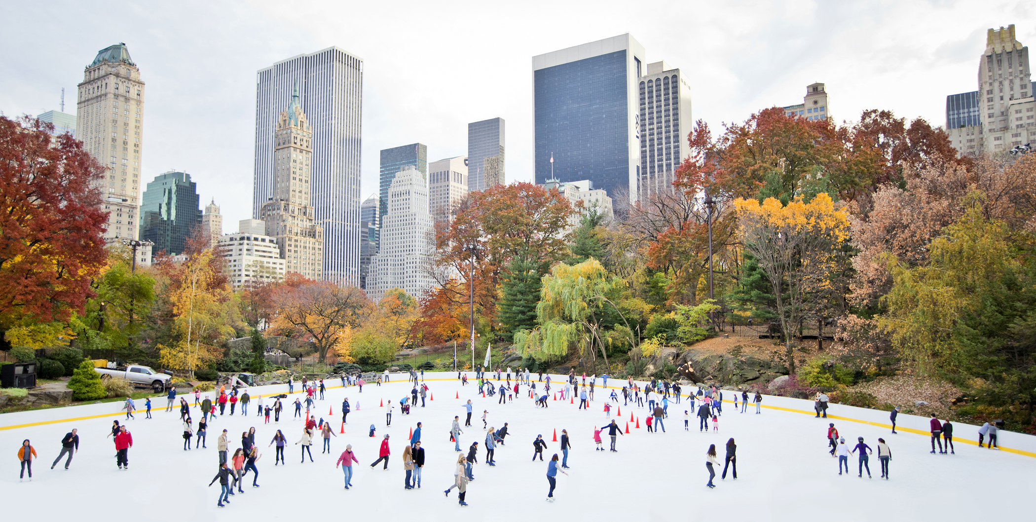 Ice skaters having fun in New York Central Park in fall